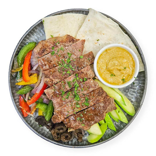 E. Grilled Mediterranean Ribeye w/ Tortilla, Garlic Hummus & Olives - 15/05/25